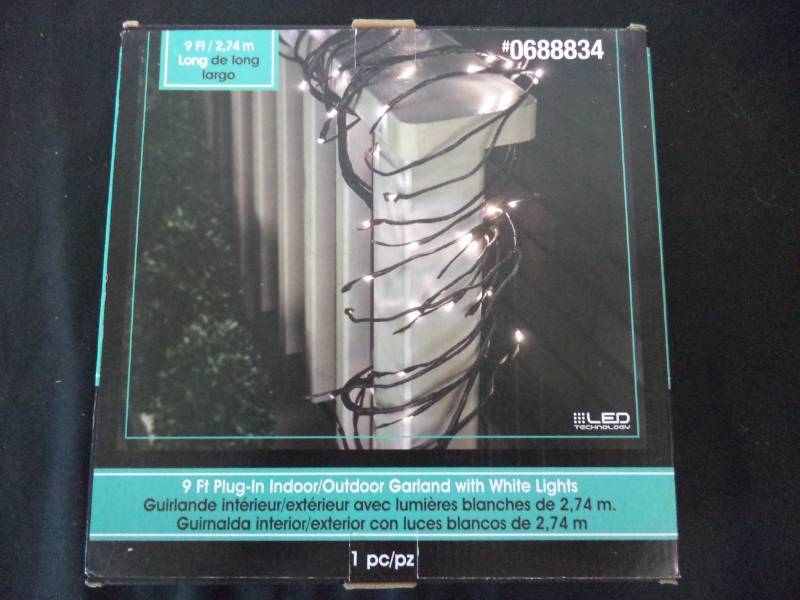 lot 2544 image: 9 ft. Indooroutdoor Garland wWhite Lights New in box