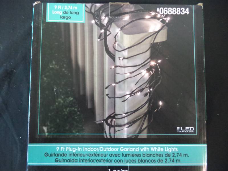 lot 2546 image: 9 ft. Indooroutdoor Garland wWhite Lights New in box