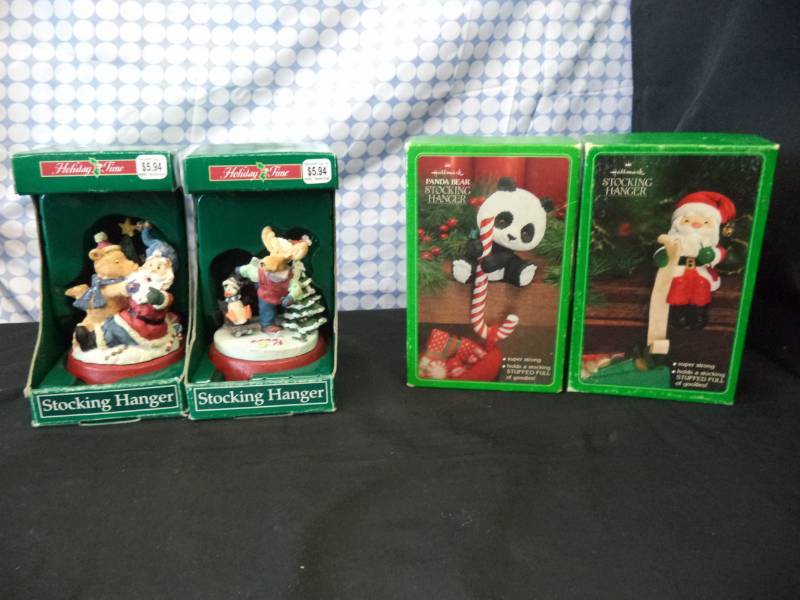 lot 2549 image: 2 Hallmark Stocking holdersNew in box. 2 Holiday Time Stocking holders New