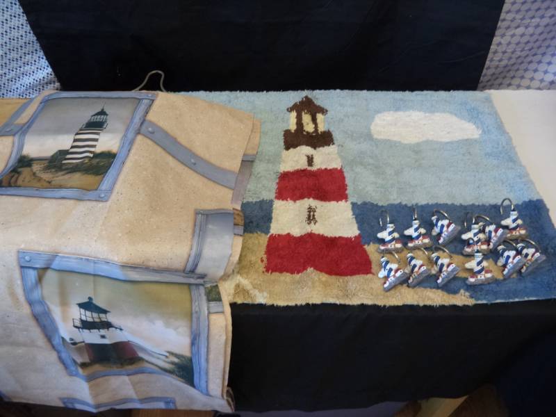 lot 2644 image: Lighthouse Bathroom Set, Shower Curtain, Hooks, Rug & Shower Caddy