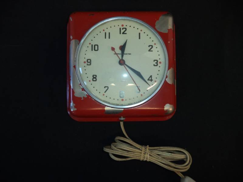 lot 2681 image: Red General Electric Plug-in Clock Works