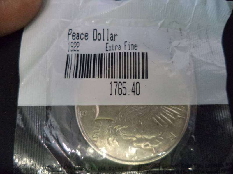 lot 2749 image: 1922 Peace One Dollar Silver Piece Extra Fine