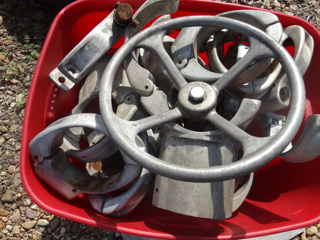 lot 5630 image: Tote full of aluminum pipe fittings & steering wheel
