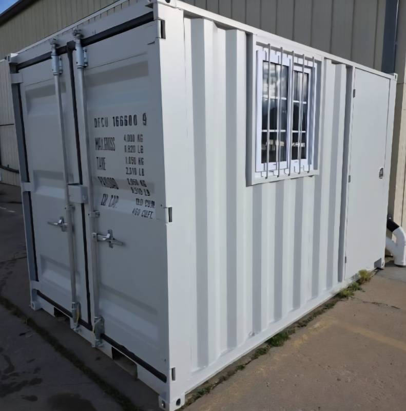 lot 5406 image: 2025 Unused 11ft Shipping Container with Office Door & Lock, Double Rear Doors, Window with Security Bars & Fork Pockets for Easy Transport - Weather, Rodent & Fireproof - Delivery Available