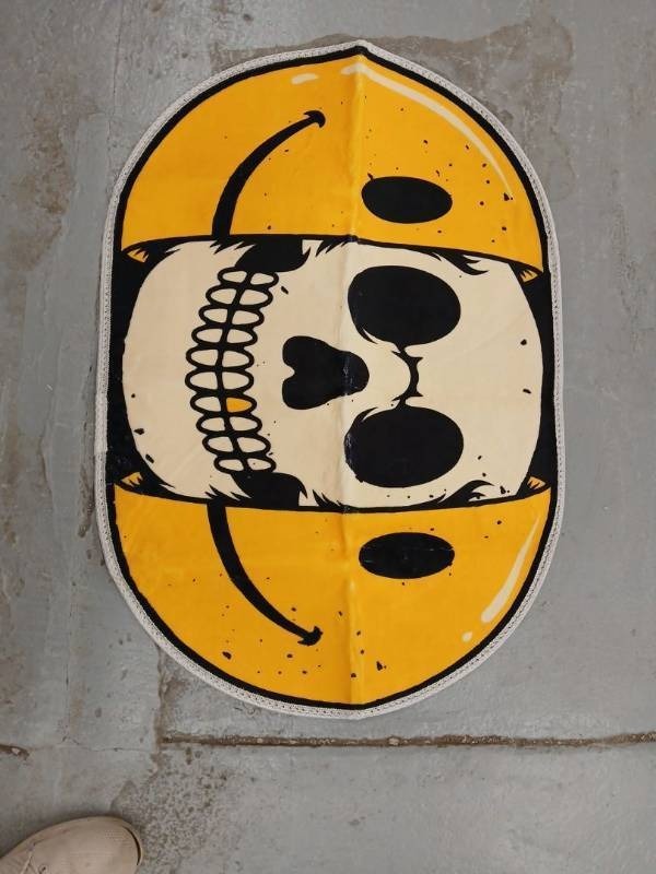 lot 45612 image: Creative smiling skull face rug 30 x 20 inch - Retail $20