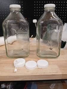lot 40423 image: Large Clear Glass Storage Jars with White Screw Caps - Retail $25