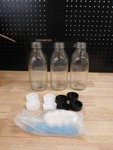 lot 40428 image: Clear Glass Milk Bottles with Lids Set - Retail $18