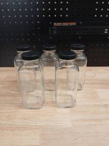 lot 40455 image: Set of 5 Clear Glass Storage Jars with Black Lids - Retail $15