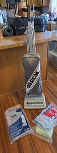 lot 106 image: Oreck XL Classic Upright Vacuum with Extra Bags (Model- XL2200RS) Powers on - needs cord replaced