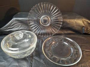 lot 217 image: Clear Glass Scalloped Serving Platter with Starburst Design, Clear Glass Platter with Medallions and  Clear Glass Casserole Dish with Lid