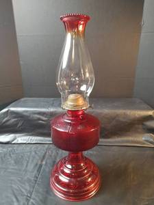 lot 469 image: Red Glass Oil Lamp with Decorative Base