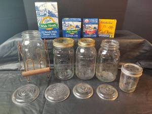 lot 517 image: Ball Mason Jar Collection with Lids, Wire Stand with Handle