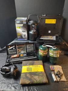 lot 530 image: Shooting & Camping Equipment Bundle, NIP Camo Netting, NIB Camping Light, Cleaning Kit and More