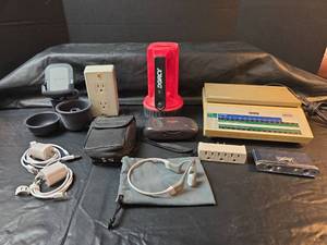 lot 629 image: Pitney Bowes Digital Postal Scale, Belkin Phone Holder, Kodak 35mm Camera, and more