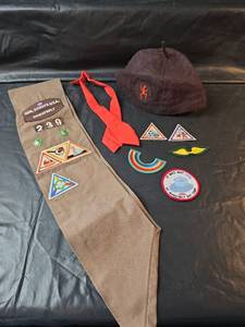 lot 636 image: Girl Scouts USA Wheatbelt Sash with Patches, Beanie, and Tie