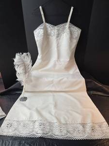 lot 653 image: Vintage White Satin Full Slip with Lace Trim and Feather Pen