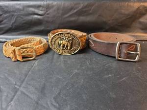lot 676 image: 1979 Hesston National Finals Rodeo Western Belt Size 36,  Eddie Bauer Belt (Plus Size), and Braided Belt