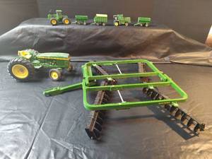 lot 728 image: John Deere Farm Equipment Toy Set