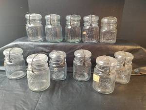 lot 743 image: Ball Ideal Glass Canning Jars with Lids and Wire Bails