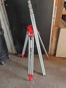 lot 6 image: CSTBerger Contractors Aluminum Tripod #60-ALQC120 and CSTBerger 16ft. Leveling Rod (both with original boxes)
