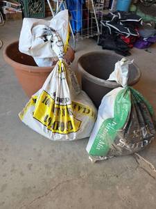 lot 1577 image: 2 Large  Plastic Planters and Potting Soil