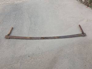 lot 1619 image: Traditional Two-Man Crosscut Saw with Wooden Handles