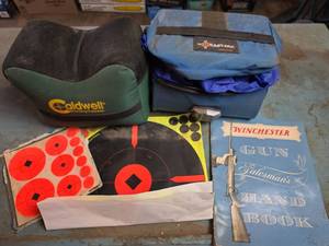 lot 1683 image: Winchester Salesmans Handbook with Shooting Supplies and 2 Heavy Duty Rain Ponches