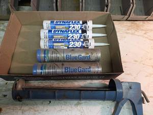 lot 2002 image: Construction Sealant, Blue Gard Grease, and Caulk Gun Set