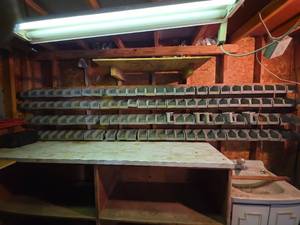 lot 2109 image: Industrial Storage Bins - 118 Plastic Stackable Containers on Aluminum Racks - IF YOU WANT THE RACKS YOU WILL NEED SCREW DRIVER OR RATCHET TO REMOVE RACKS