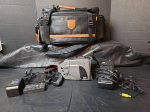 lot 3106 image: JVC Compact VHS Camcorder Bundle with Accessories