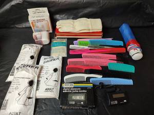 lot 3163 image: Mixed Lot - NIP Personal Items, Digital Electronic Exercise Plus Monitor, Gloves, Lint Remover, Combs, Adult Ponchos and Umbrella