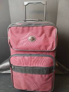 lot 3270 image: American Tourister Rolling Suitcase with Retractable Handle, Durable Wheels and Multiple Storage Sections