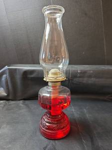 lot 406 image: Red Glass Oil Lamp with Decorative Base