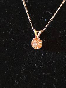 lot 480 image: 14K Gold Diamond Solitaire Pendant Necklace Wt. 0.92gm