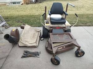 lot 6 image: Grasshopper 411 Zero Turn Riding Lawn Mower with Front Mounted Deck and Attachments (Tires Need Air)