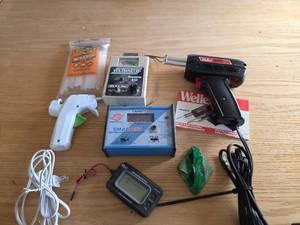 lot 6043 image: Weller Soldering Gun, Hot Glue Gun, Gorilla Glue Sticks, Battery Capacity Analyzer, and Voltmaster