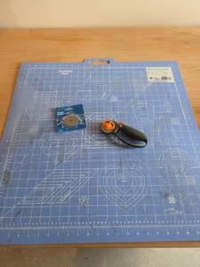 lot 6137 image: Cutting Mat, Rotary Cutter, and Extra Blade