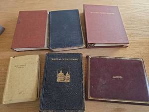 lot 6152 image: Mennonite Hymnals, Illustrated Bible, and New Guest Book