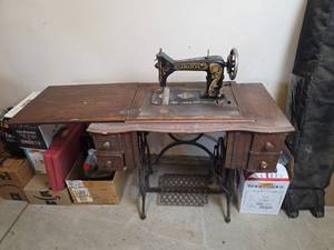 lot 6167 image: Damascus Treadle Sewing Machine with Cabinet and Accessories