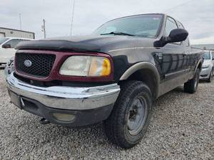 lot 10850 image: 2002 Ford F-150 Lariat Super Cab Long Bed 4WD  BLACK