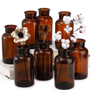 lot 1785 image: TOPZEA Set of 8 Amber Glass Vase, 17oz Boho Flower Vase Bud Vases Decorative Brown Medicine Glass Bottles Vintage Small Apothecary Jars for Home Dcor, Dining Table, Wedding Centerpiece, Bridal Shower - Retail $29