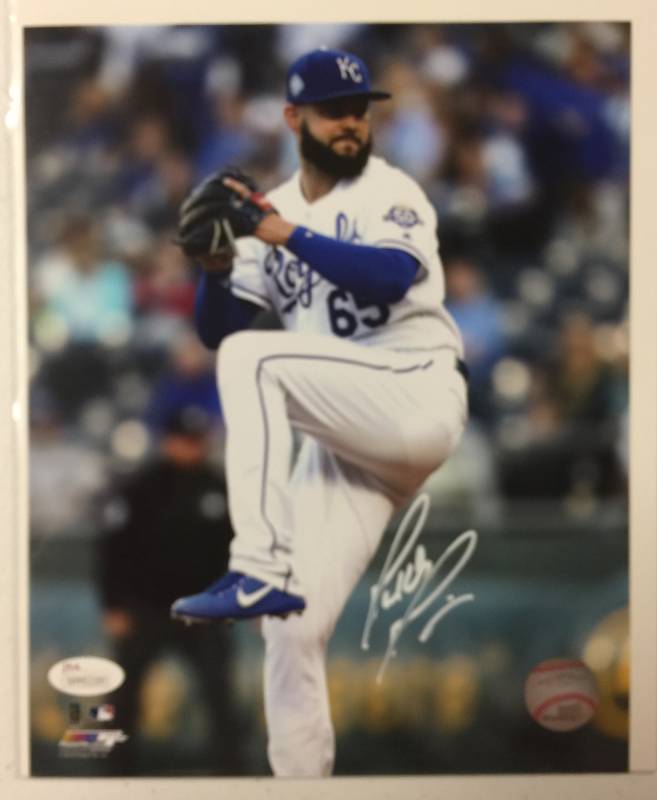 lot 1058 image: Signed Jakob Junis 8x10 Glossy Photograph Kansas City Royals Stud Pitcher in White Ink With James Spence Witnessed Authentication