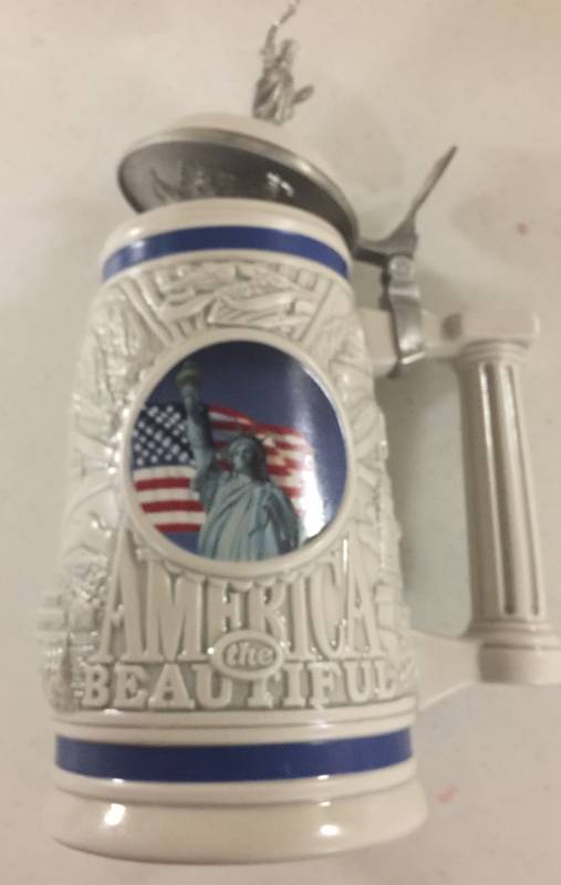 lot 1267 image: 1999 Avon Collectors Stein America the Beautiful with Statue of Liberty