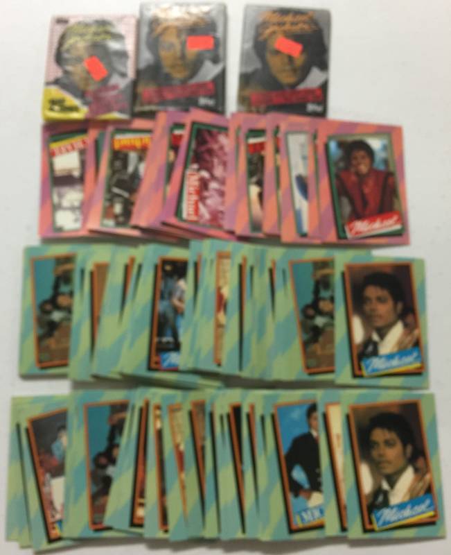 lot 1196 image: Large Lot of 1984 Topps Michael Jackson Trading Cards - 3 Sealed Packs - Very Close to Complete Sets with Lots of Duplicates