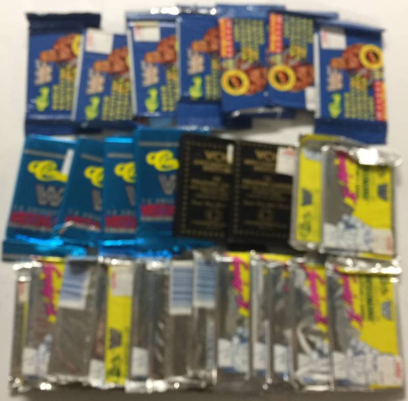 lot 1194 image: 25 Sealed Packs of WWF & WCW Wrestling Cards from 1990s