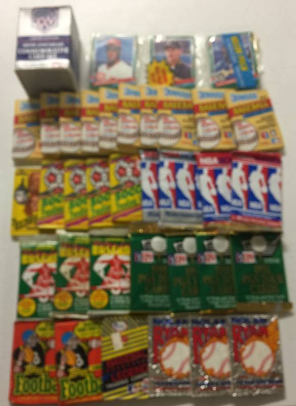 lot 1192 image: Over 30 Sealed Wax packs of Sports Cards including Baseball, Golf, Soccer, Football, Basketball with Flat of Sports Memorabilia