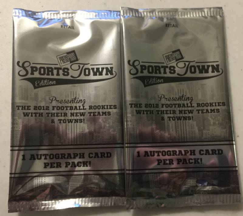 lot 1075 image: Two Sealed 2012 Press Pass Sportstown Football Card Packs with Two Guaranteed Rookie Autographs Russell Wilson Luck