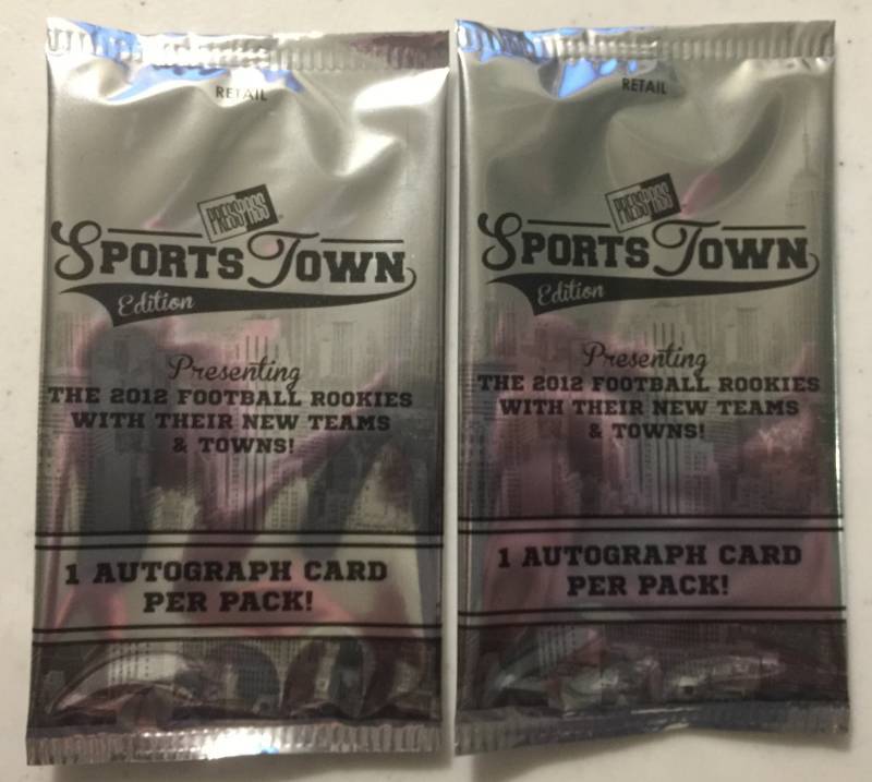lot 1076 image: Two Sealed 2012 Press Pass Sportstown Football Card Packs with Two Guaranteed Rookie Autographs Russell Wilson Luck
