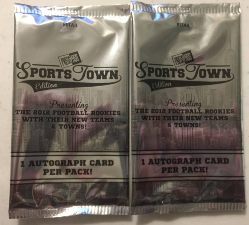 lot 1078 image: Two Sealed 2012 Press Pass Sportstown Football Card Packs with Two Guaranteed Rookie Autographs Russell Wilson Luck