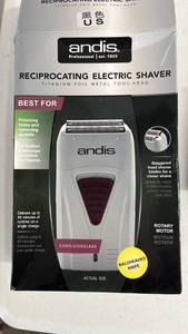 lot 17107 image: Andis Professional Reciprocating Electric Shaver ( turns on but missing cord) - Retail $65